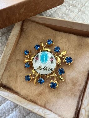 Vintage Art Nouveau style Mother Floral Brooch with blue in a vintage box.